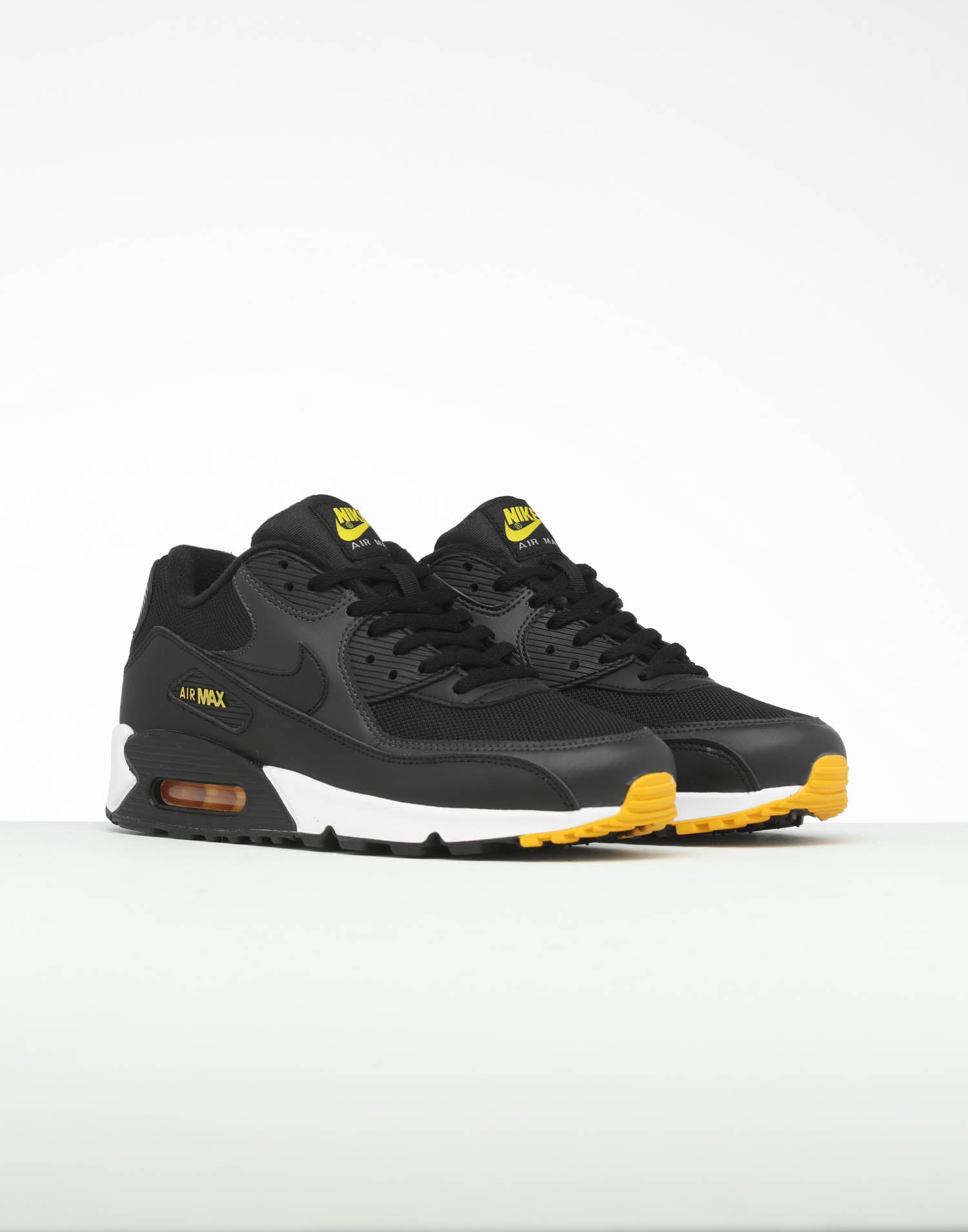 black white and yellow air max
