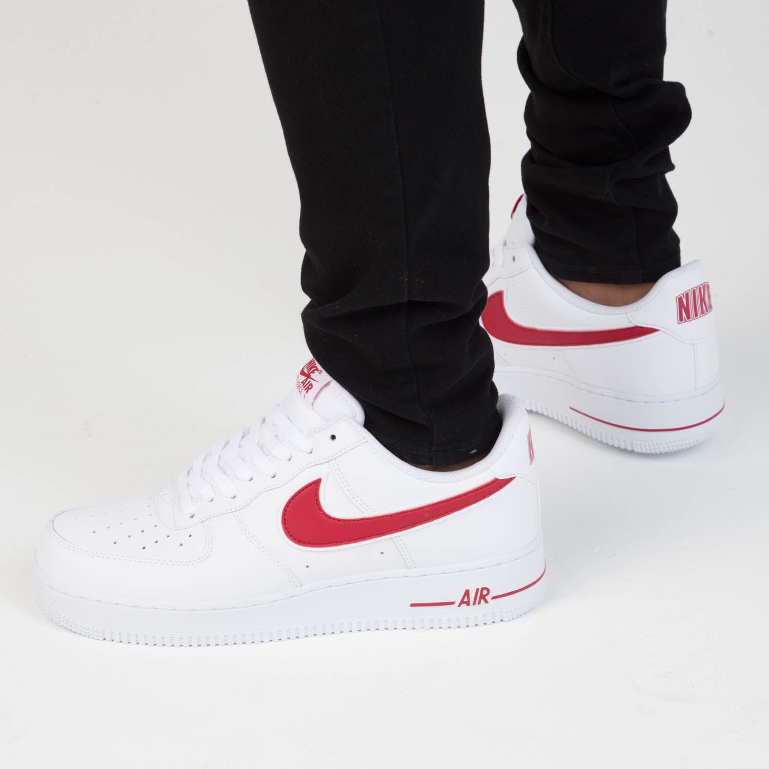 red tick nike air force 1